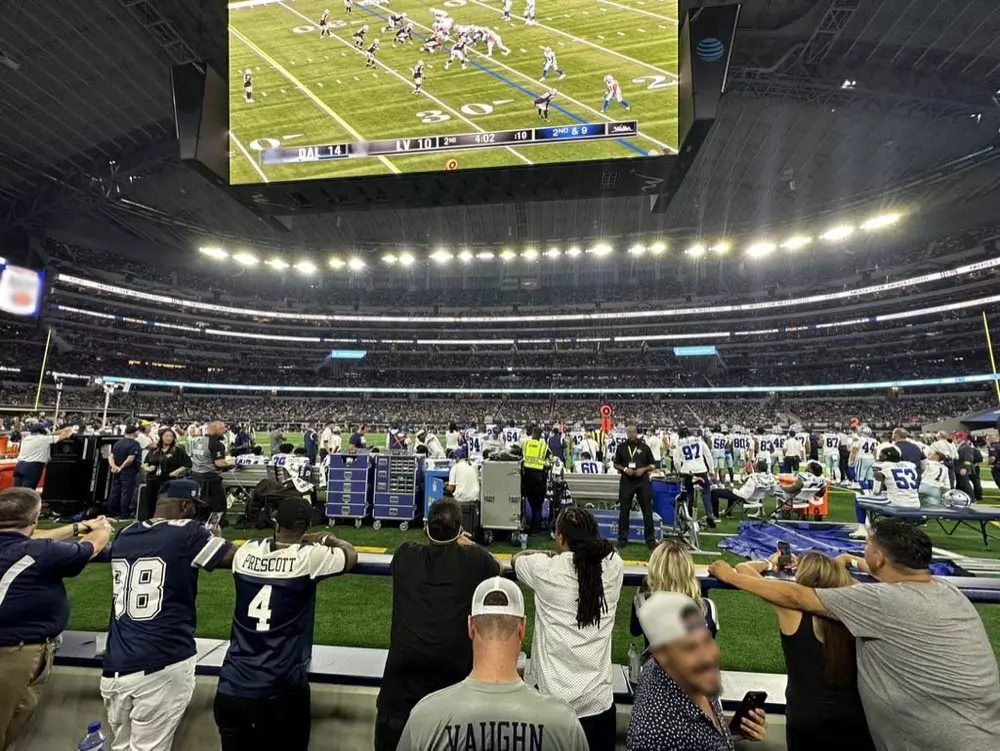 View of the Dallas Cowboys bench from the Miller Lite Club. Field Suites on the Visitors side have access to the DraftKings Lounge with the same experience. 
